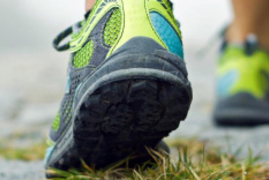Photo: Close-up of athletic sneakers on pavement
