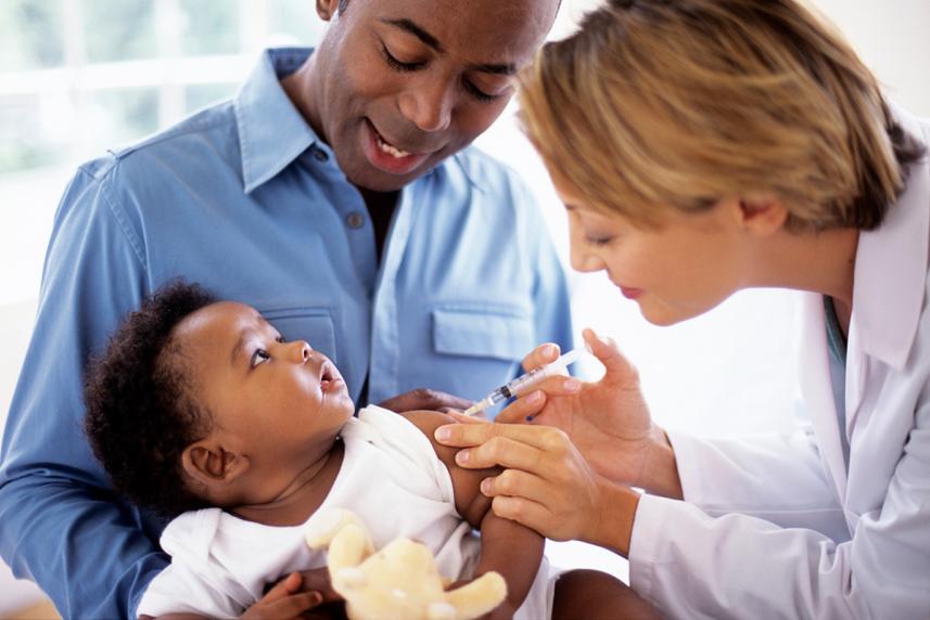 Doctor giving a baby a shot