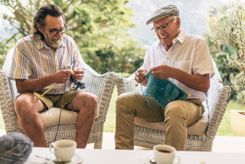 Two men knitting