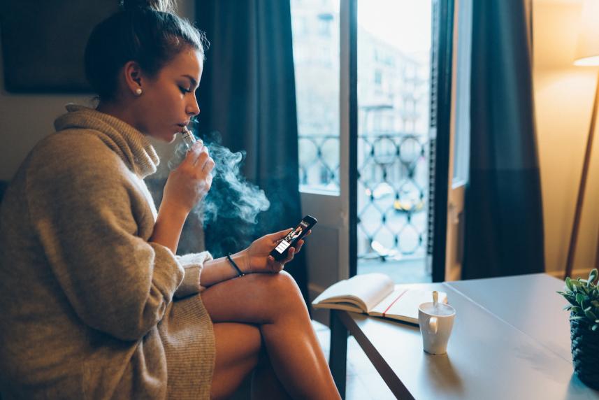 Woman using an e-cigarette