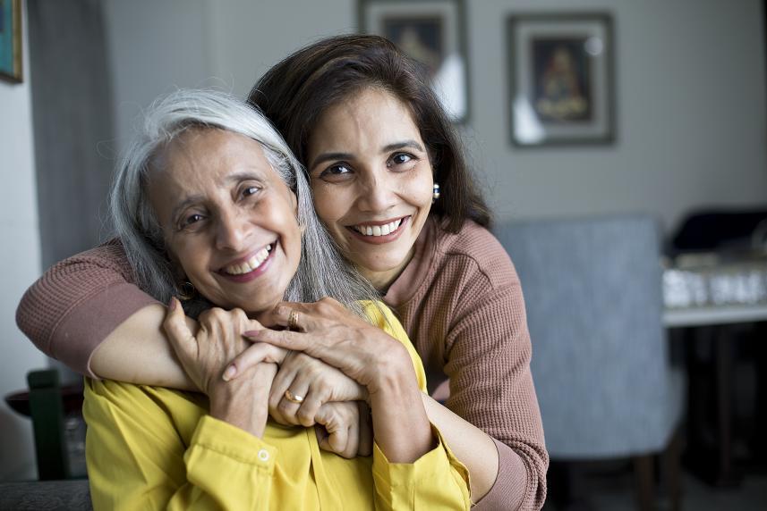 Mother hugging daughter