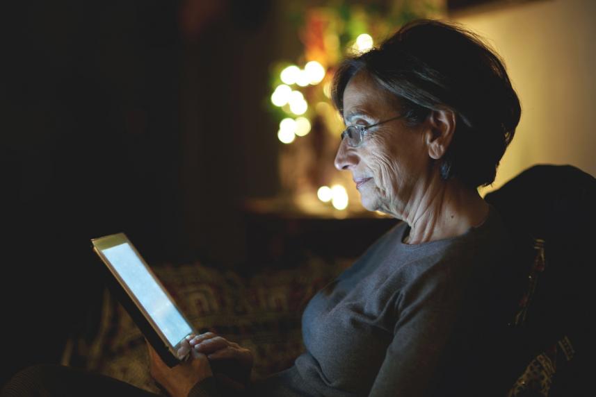 Photo: Older woman looking at computer