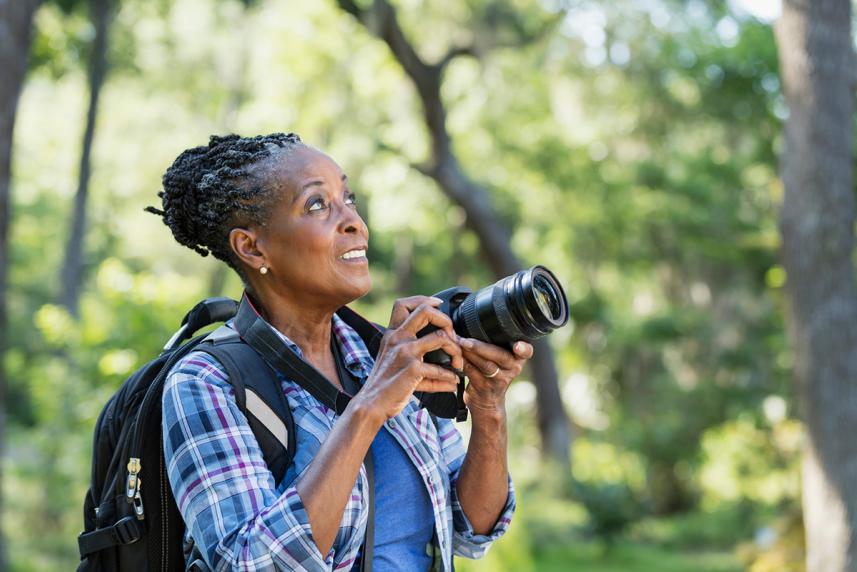 Woman taking a photo outside