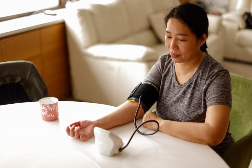 Woman measuring blood pressure