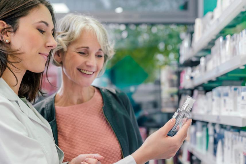 older woman looking at prescriptions