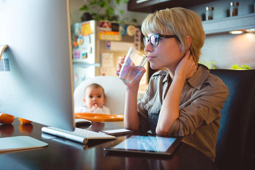 Woman using the computer to estimate health care costs