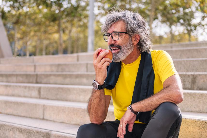 Man eating apple
