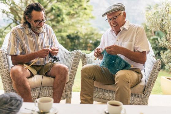 Two men knitting