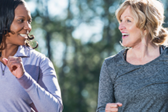 Photo: Happy women walking quickly